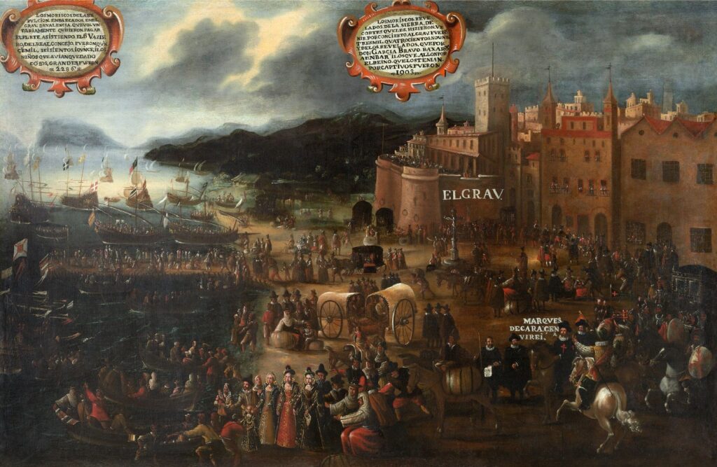 En la distancia se ven los edificios del puerto de Valencia y en la playa y los muelles gran número de personas que suben a barcos grandes y pequeños. La fortaleza es rotulada "El Grao" y un señor llevando la cruz del Orden de Santiago es rotulado como el Virrey