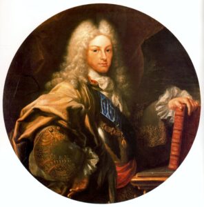retrato del rey Felipe V llevando ropa civil y una peluca (wig) blanca típica del siglo XVIII, sosteniendo un libro en la mano